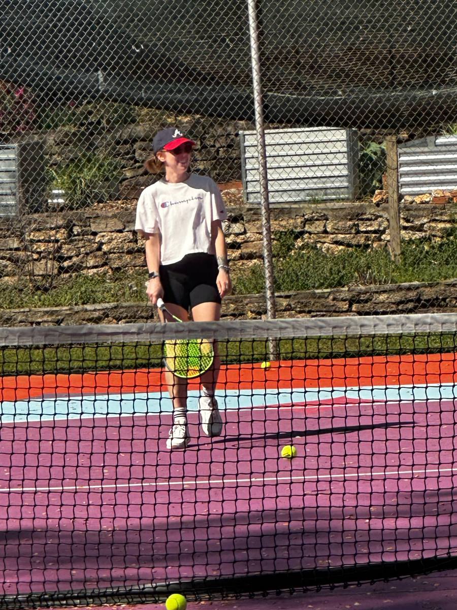 A player serving on the painted courts at Brownwood Park